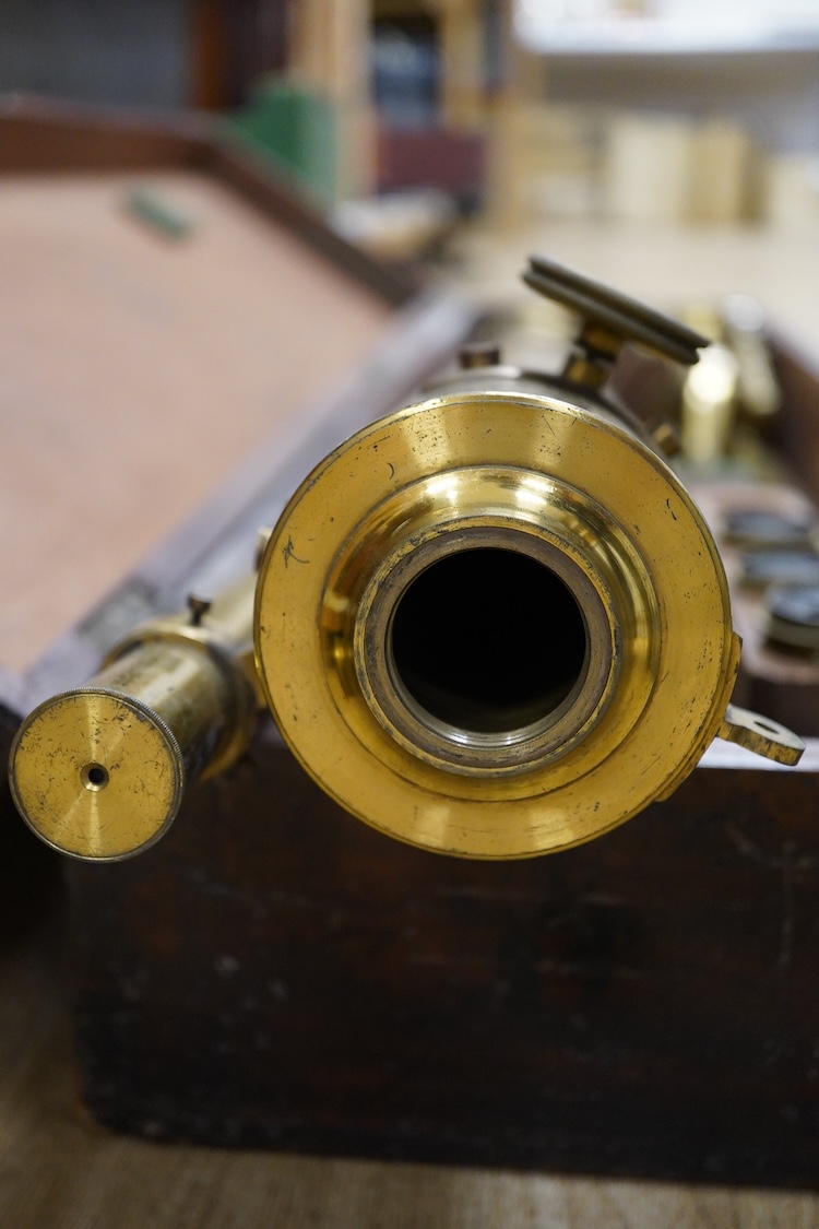 A late 19th century brass single drawer refracting telescope by F.L. West, 39 Southampton Street, Strand, London, in a fitted mahogany case, with folding brass tabletop tripod stand, and a number of alternative lenses, t